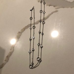 Long silver necklace. Adjustable and can be worn in different ways.